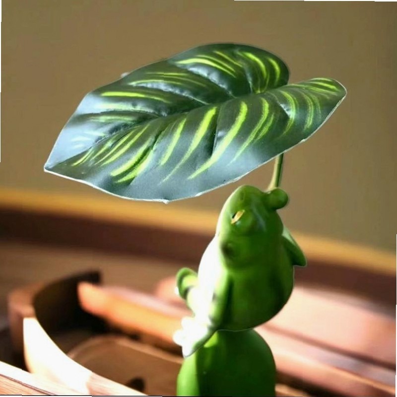 تمثال حديقة على شكل ضفدع يحمل  - مراجعة Aquarium Decor وسعره